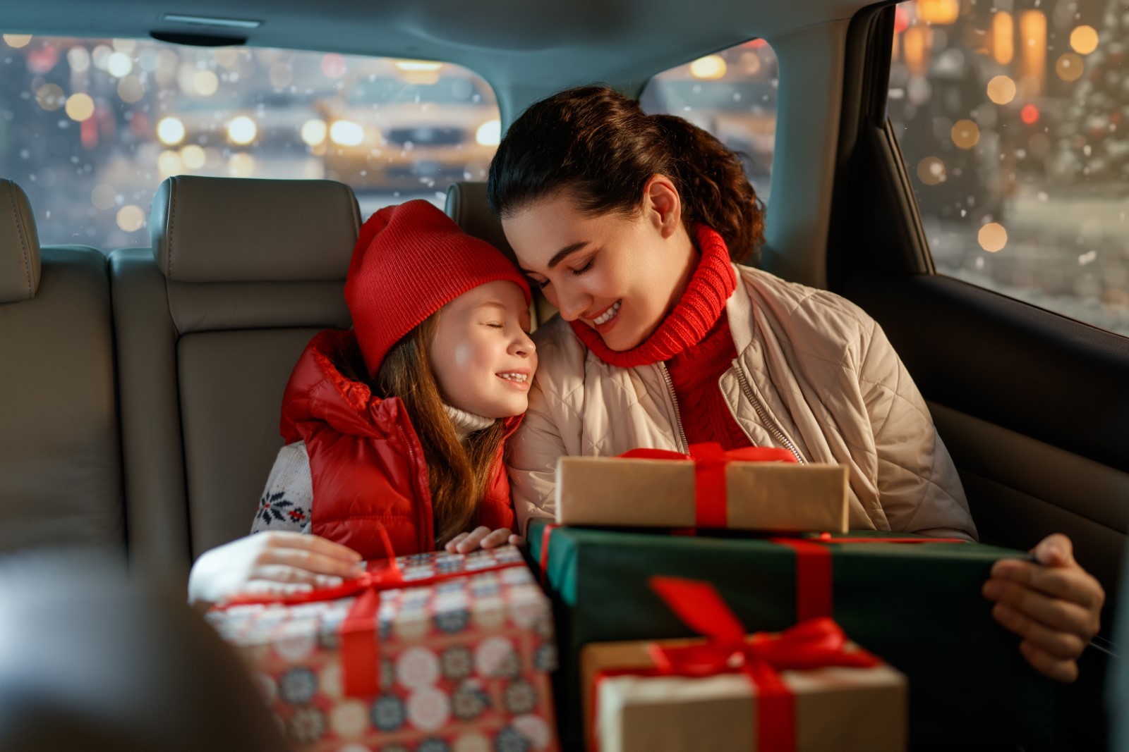 mother and child delivering gifts to Toys for Tots