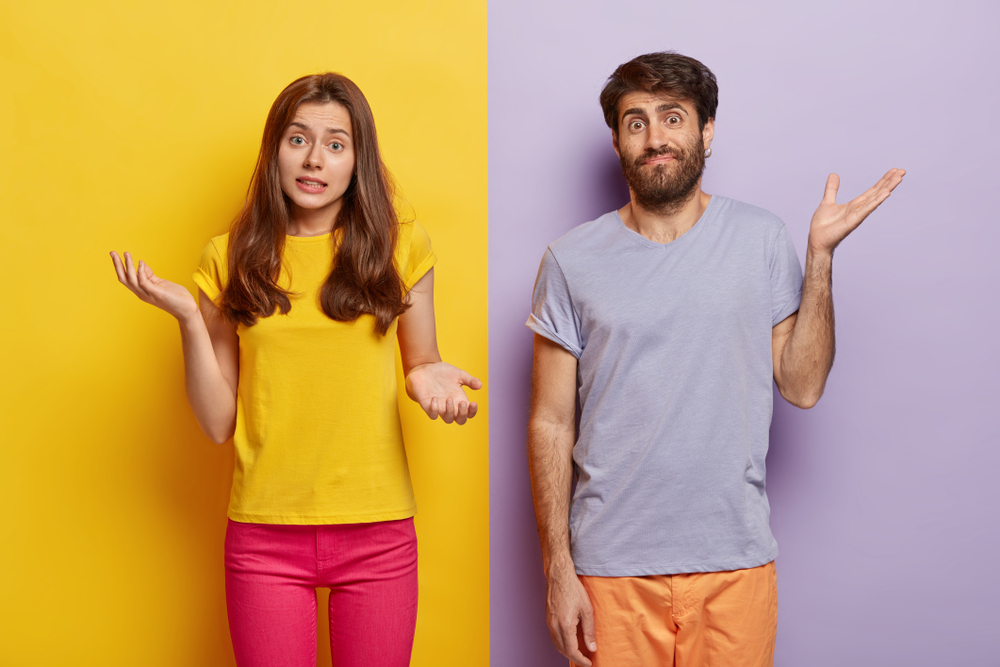 a male and a female gesturing uncertainty about how air conditioners really work